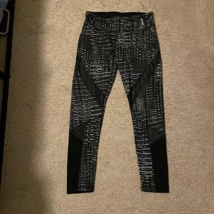 Reebok women’s black and white leggings, fun design with mesh cutouts
